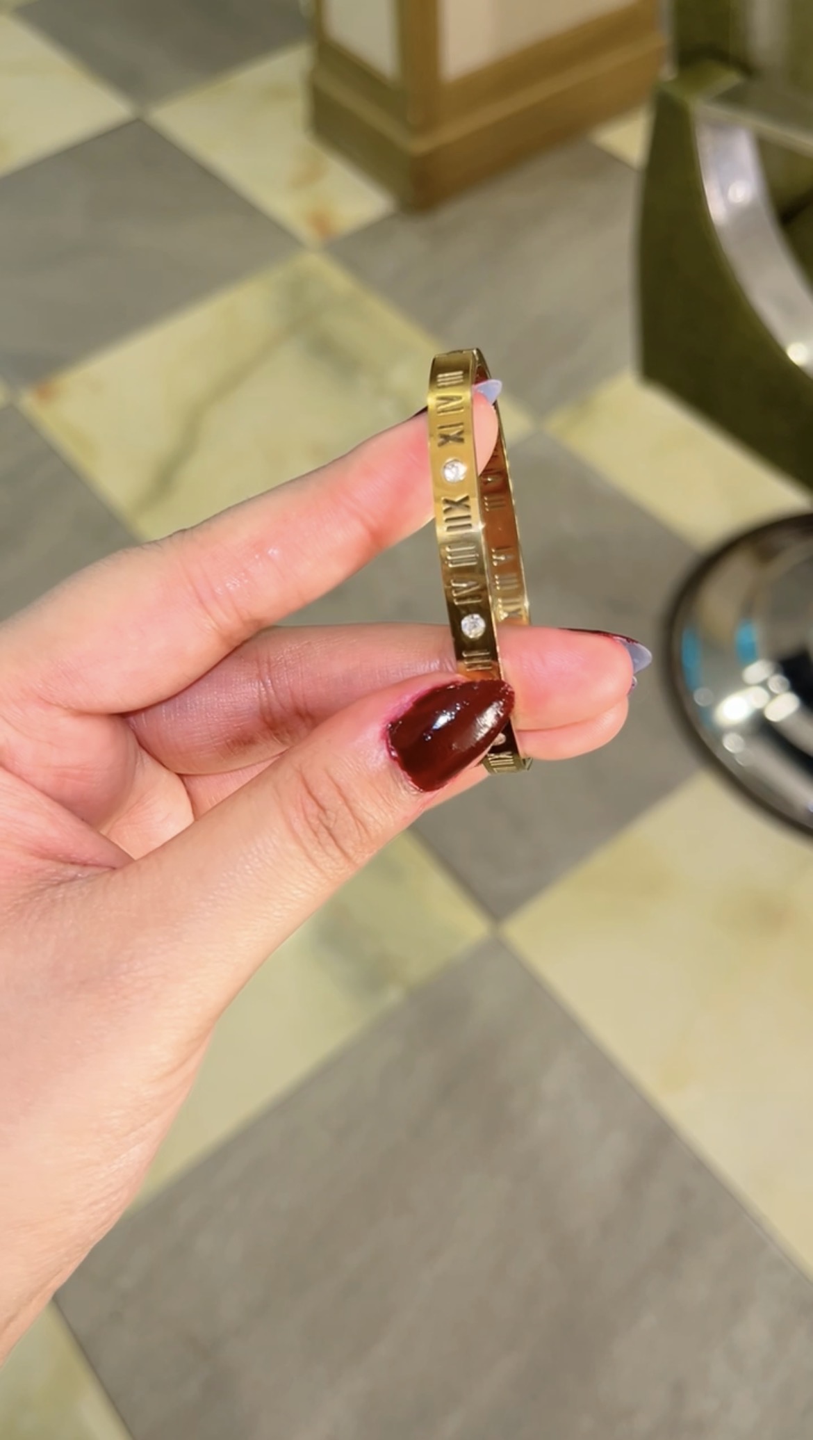 Structured bangle engraved with Roman numerals and set stones