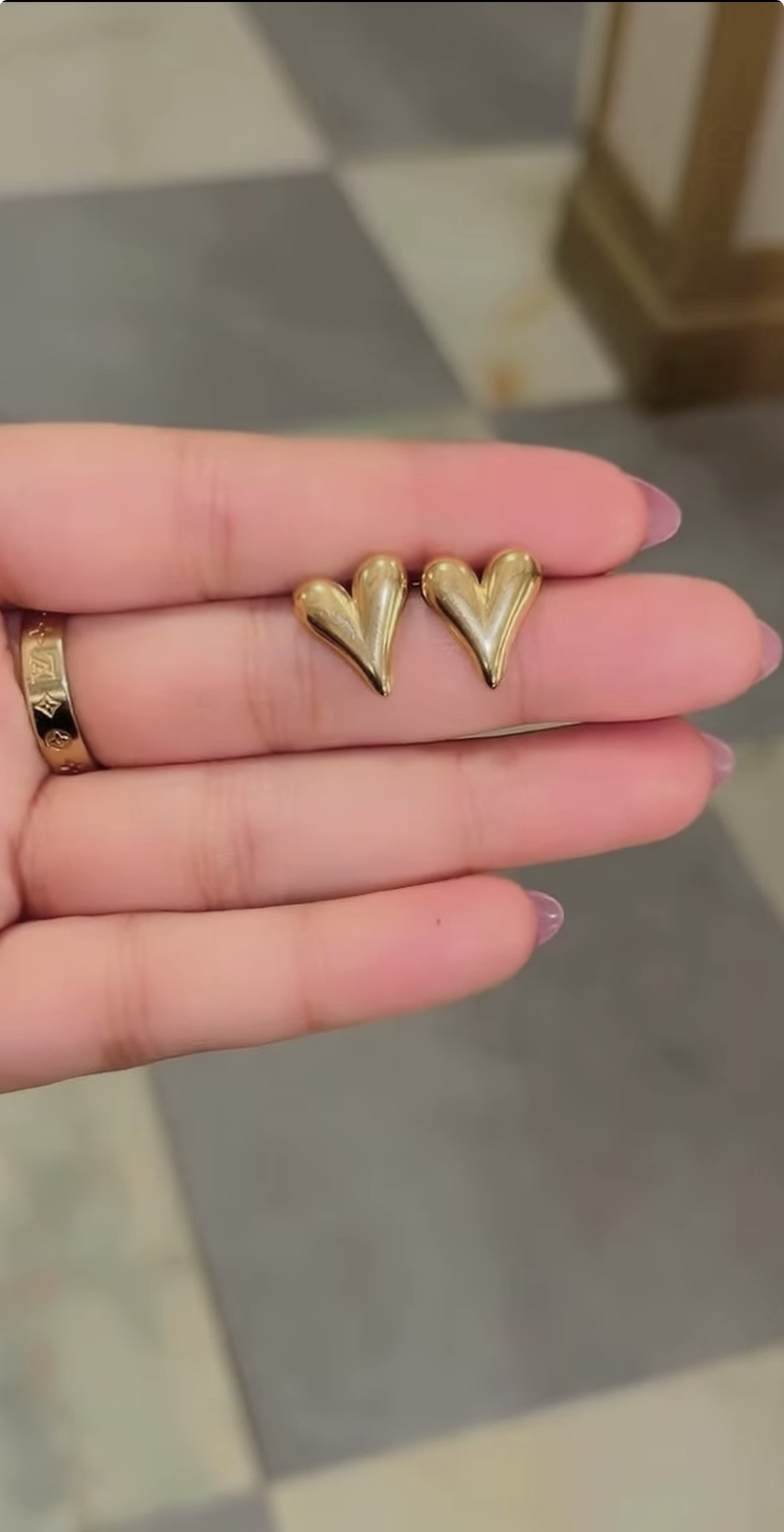 Gold heart shaped stud earrings