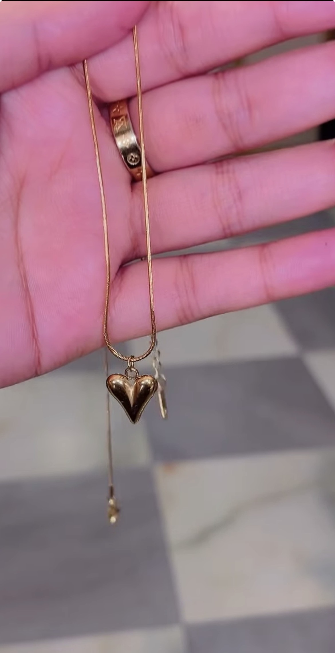 Gold snake chain necklace with heart pendant